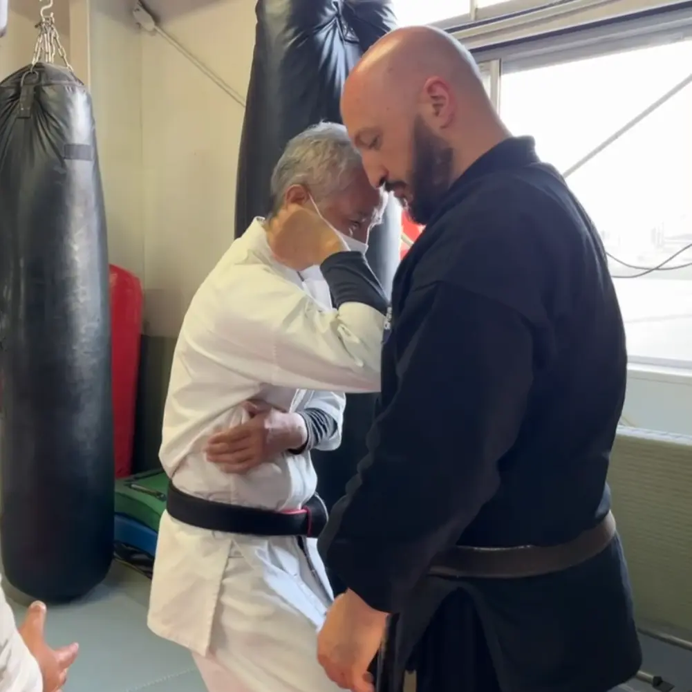 Olgun Tiltay learning empi elbow techniques from Nobuya Tagami Sensei [9th Dan Tomarite Karate] in Ise Japan